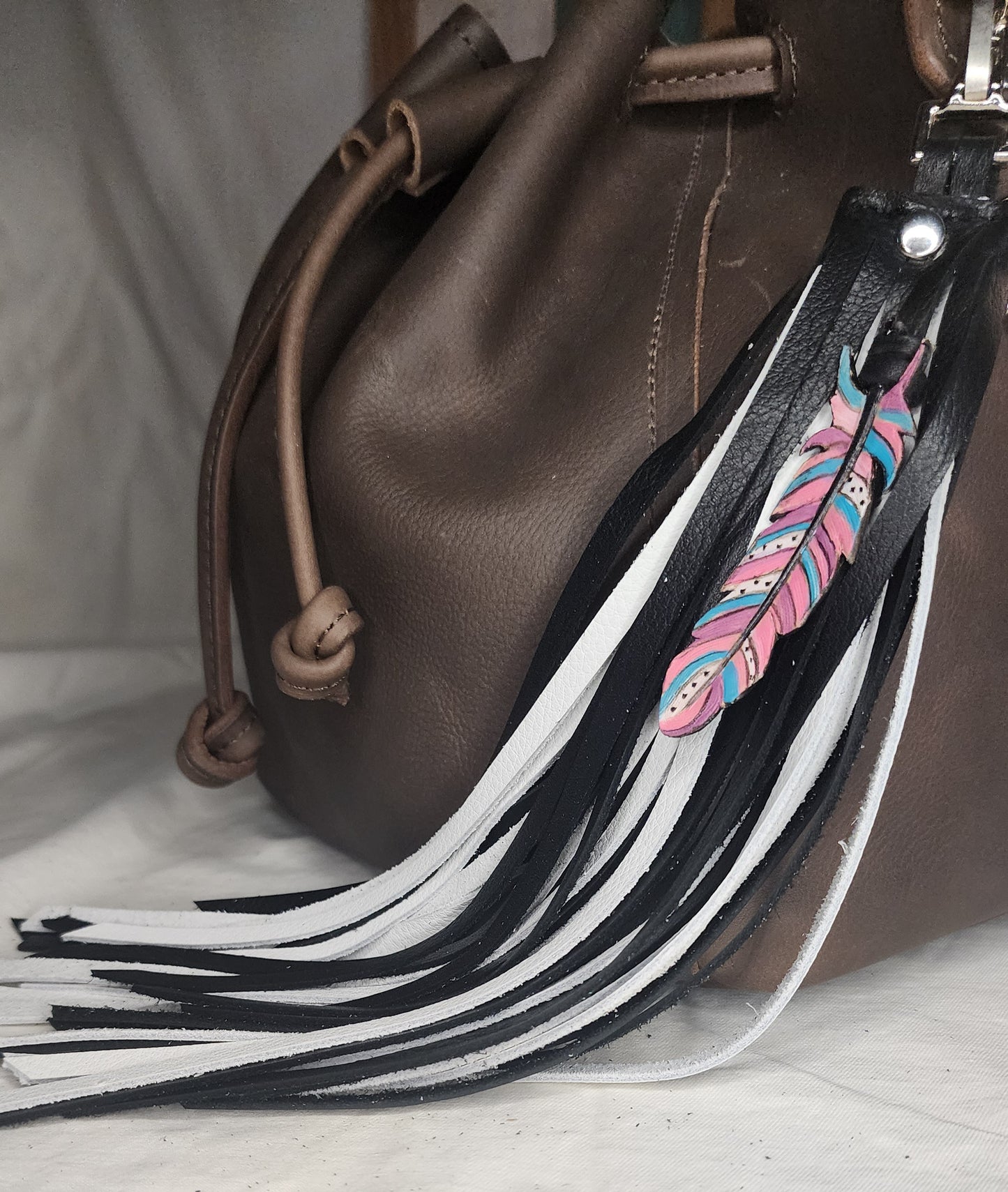 Fringe bag charm with pink feather